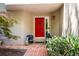 Inviting red front door with decorative plants and charming curb appeal at 3188 Paces Mill Se Rd, Atlanta, GA 30339