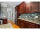 This kitchen features stainless steel appliances, granite countertops, and attractive wooden cabinets and floors at 3188 Paces Mill Se Rd, Atlanta, GA 30339