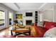 Bright and airy living room with hardwood floors, fireplace, and ample natural light at 3188 Paces Mill Se Rd, Atlanta, GA 30339