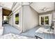 A spacious covered patio with ceiling fan and sliding glass door access to the interior at 3188 Paces Mill Se Rd, Atlanta, GA 30339