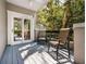 A cozy outdoor patio with comfortable seating and natural light from the surrounding trees at 3188 Paces Mill Se Rd, Atlanta, GA 30339
