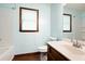 This bathroom features wood-style floors and a sleek white vanity at 1061 Retner Dr, Mableton, GA 30126