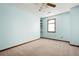 Spacious bedroom with light blue walls, a ceiling fan, and a window at 1061 Retner Dr, Mableton, GA 30126