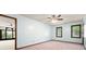 A calming blue bedroom with three windows overlooking a green, lush landscape at 1061 Retner Dr, Mableton, GA 30126