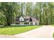 Traditional two-story home with a inviting front porch and a long driveway at 1061 Retner Dr, Mableton, GA 30126