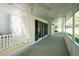 Spacious covered porch with swing, providing a comfortable outdoor seating area at 1061 Retner Dr, Mableton, GA 30126