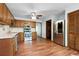 Well-lit kitchen with stainless steel appliances, wood cabinets, and hardwood floors at 1061 Retner Dr, Mableton, GA 30126