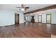A spacious living room with hardwood floors, ceiling fans, exposed beam, and natural light at 1061 Retner Dr, Mableton, GA 30126