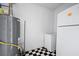 The utility room features black and white checkerboard tiles, a fridge, and a water heater at 1061 Retner Dr, Mableton, GA 30126