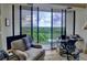 Balcony with seating and stunning views of the surrounding nature and cityscape at 145 15Th Ne St # 1015, Atlanta, GA 30309
