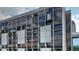 Modern condominium building featuring large windows and private balconies in an urban setting at 145 15Th Ne St # 1015, Atlanta, GA 30309