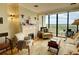 Bright living room features fireplace, large windows, and comfortable seating at 145 15Th Ne St # 1015, Atlanta, GA 30309