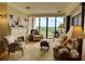 Comfortable living room with fireplace and oversized windows providing natural light at 145 15Th Ne St # 1015, Atlanta, GA 30309