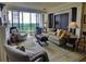 Comfortable living room with fireplace, plush seating, and balcony access at 145 15Th Ne St # 1015, Atlanta, GA 30309