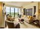 Inviting living room features plush seating, oversized windows, and charming decor at 145 15Th Ne St # 1015, Atlanta, GA 30309