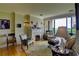Relaxing living room featuring a fireplace, hardwood floors, and floor to ceiling window at 145 15Th Ne St # 1015, Atlanta, GA 30309