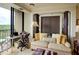 Brightly lit living room with a cozy seating area and balcony access at 145 15Th Ne St # 1015, Atlanta, GA 30309