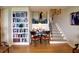 Cozy living area featuring a bookcase and staircase at 145 15Th Ne St # 1015, Atlanta, GA 30309