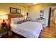 Comfortable bedroom featuring natural light, hardwood floors, and neutral decor at 145 15Th Ne St # 1015, Atlanta, GA 30309