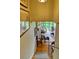 A staircase leading to a bright living room with a wall to wall glass window at 145 15Th Ne St # 1015, Atlanta, GA 30309