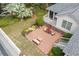 Aerial view of a brick patio with seating, nestled in a well-manicured backyard landscape at 3038 Nancy Creek Nw Rd, Atlanta, GA 30327