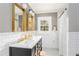 Modern bathroom featuring double vanity, subway tile, and designer fixtures at 3038 Nancy Creek Nw Rd, Atlanta, GA 30327