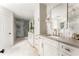 Elegant bathroom featuring marble accents, a spacious shower, and vanity storage at 3038 Nancy Creek Nw Rd, Atlanta, GA 30327