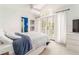 Serene bedroom boasts a high ceiling, a beautiful window, and stylish decor, creating a peaceful retreat at 3038 Nancy Creek Nw Rd, Atlanta, GA 30327