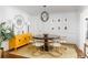 Bright dining room featuring modern lighting, colorful artwork, and hardwood floors at 3038 Nancy Creek Nw Rd, Atlanta, GA 30327