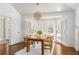 Bright dining room with natural light, a wooden table, and an interior view to another room at 3038 Nancy Creek Nw Rd, Atlanta, GA 30327