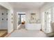 Light and bright foyer with stylish console table and decorative accents at 3038 Nancy Creek Nw Rd, Atlanta, GA 30327