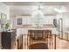 Spacious kitchen with an island, bar stool seating, stainless steel appliances and a large window at 3038 Nancy Creek Nw Rd, Atlanta, GA 30327