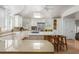 Large kitchen with a kitchen island, bar stool seating, modern appliances, and plenty of cabinet space at 3038 Nancy Creek Nw Rd, Atlanta, GA 30327