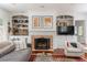 Cozy living room with fireplace, built-in bookshelves, and comfortable seating at 3038 Nancy Creek Nw Rd, Atlanta, GA 30327
