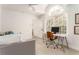 Bright office space features a large window, modern desk, and comfortable seating, perfect for a productive work environment at 3038 Nancy Creek Nw Rd, Atlanta, GA 30327
