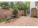 Secluded brick patio with plants and cozy seating, creating a private outdoor escape for relaxation at 3038 Nancy Creek Nw Rd, Atlanta, GA 30327
