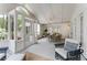 Relaxing screened patio featuring comfortable seating, a dining area, and beautiful views at 3038 Nancy Creek Nw Rd, Atlanta, GA 30327