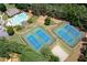 This aerial view highlights community amenities like tennis courts, a playground, and a luxurious swimming pool at 4955 Kingsbridge Ct, Powder Springs, GA 30127