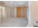 Finished basement area with built-in shelving and wooden accent wall, perfect for storage or entertainment at 4955 Kingsbridge Ct, Powder Springs, GA 30127