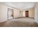 Finished basement featuring neutral walls, carpeted floor, and multiple doorways providing flexible living space at 4955 Kingsbridge Ct, Powder Springs, GA 30127