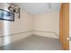 Unfinished basement area with concrete floor, vintage light fixture, and ample space for storage or customization at 4955 Kingsbridge Ct, Powder Springs, GA 30127