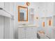 Unique bathroom with white vanity and sink, toilet, and colorful accents creating a vibrant and eclectic space at 4955 Kingsbridge Ct, Powder Springs, GA 30127