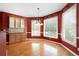 Bright breakfast nook features hardwood floors and large windows at 4955 Kingsbridge Ct, Powder Springs, GA 30127