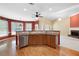 Open concept kitchen with granite countertops, stainless steel appliances, and hardwood floors at 4955 Kingsbridge Ct, Powder Springs, GA 30127