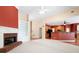 Open-concept living room with a fireplace and view of the kitchen at 4955 Kingsbridge Ct, Powder Springs, GA 30127
