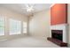 Spacious living room featuring a fireplace and large windows at 4955 Kingsbridge Ct, Powder Springs, GA 30127