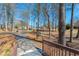 A path leads to the playground, surrounded by mature trees, in this Gathering-friendly community at 4955 Kingsbridge Ct, Powder Springs, GA 30127
