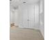 Bedroom featuring double doors and neutral carpet at 535 Pearl St, Cumming, GA 30040
