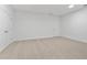 Spacious bedroom features neutral carpet and baseboards, with a double-door closet and a separate closet at 535 Pearl St, Cumming, GA 30040