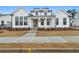 Charming two-story home with modern white siding, black trim, brick walkway, and fresh landscaping at 535 Pearl St, Cumming, GA 30040